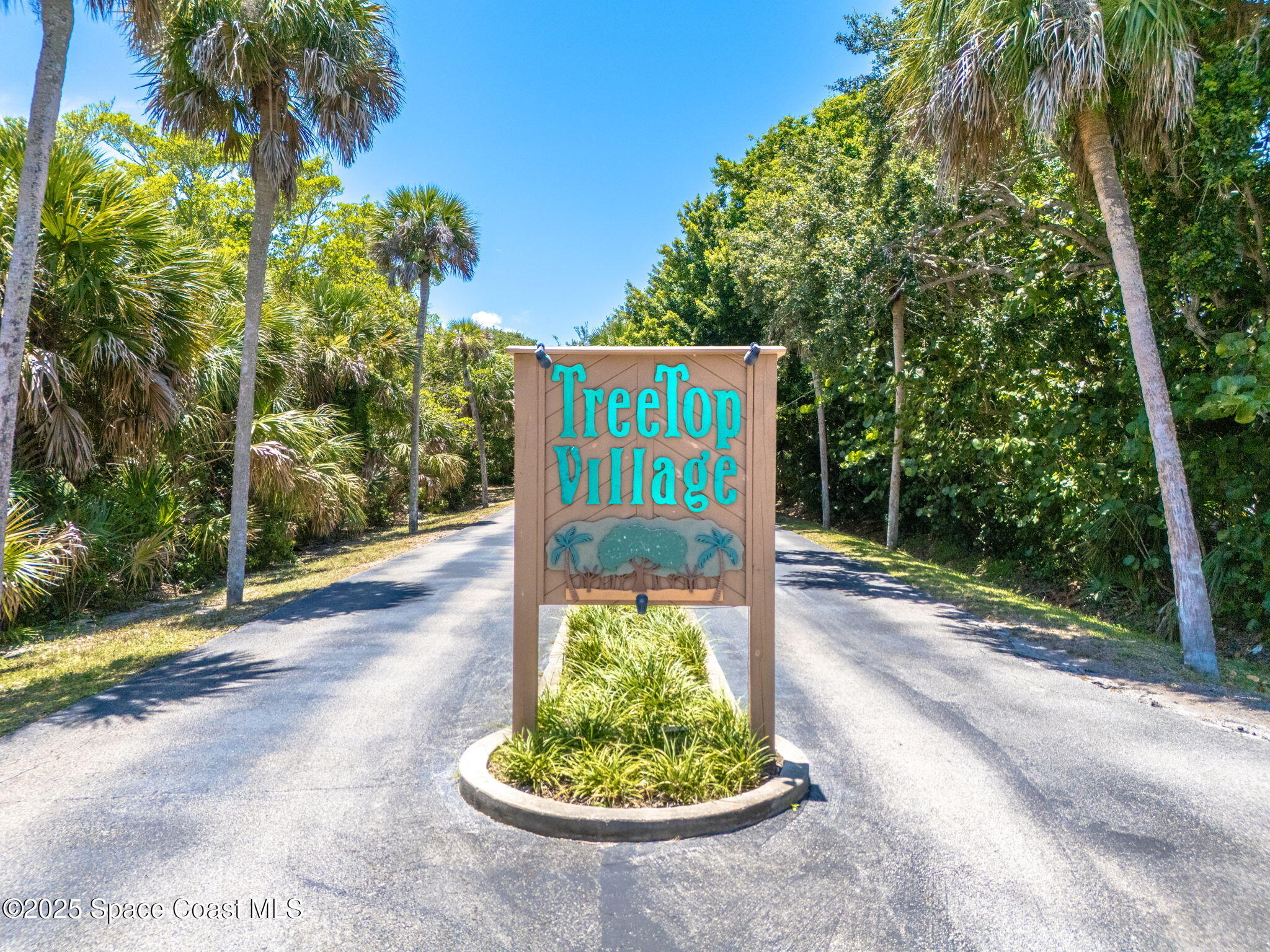 6205 Treetop Drive Melbourne Beach, FL 32951 - Photo 27 of 36 a view of a street with a tree