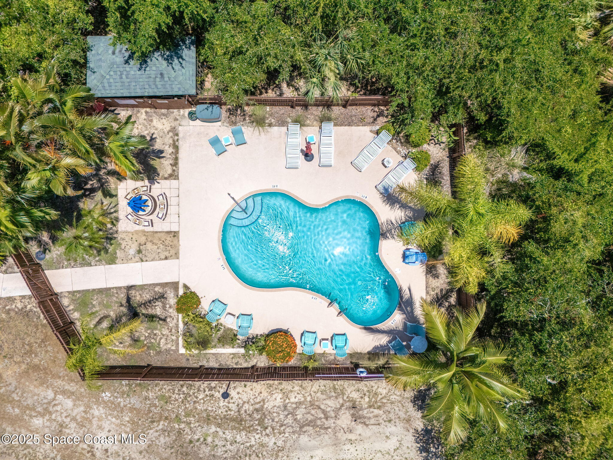 6205 Treetop Drive Melbourne Beach, FL 32951 - Photo 30 of 36 a view of outdoor space and garden