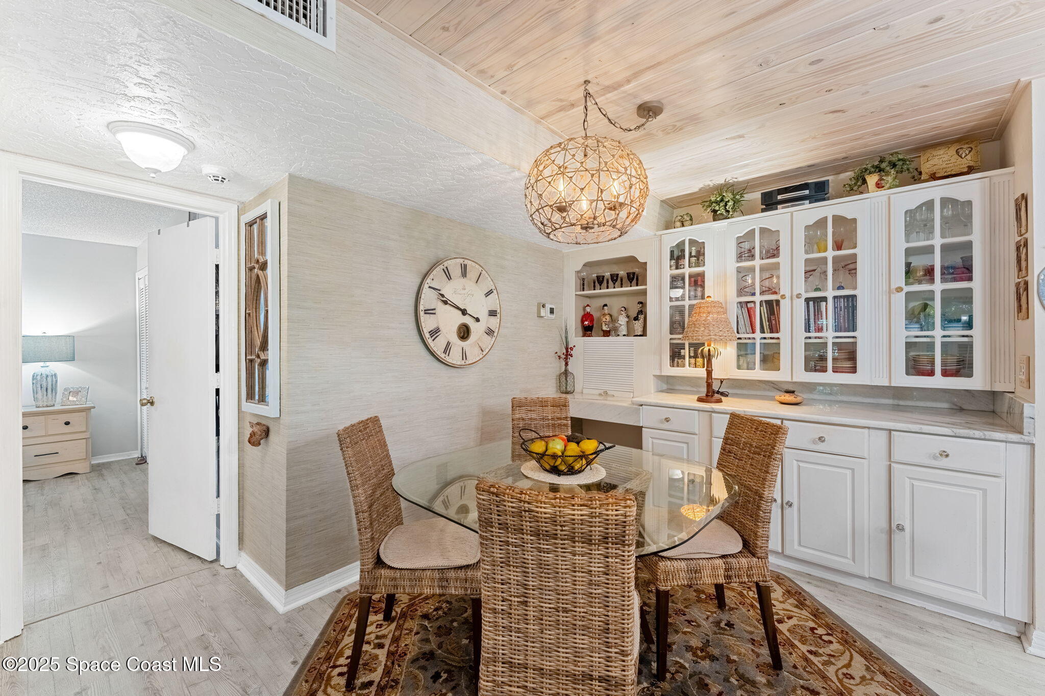 6205 Treetop Drive Melbourne Beach, FL 32951 - Photo 8 of 36 a view of a dining room and chandelier