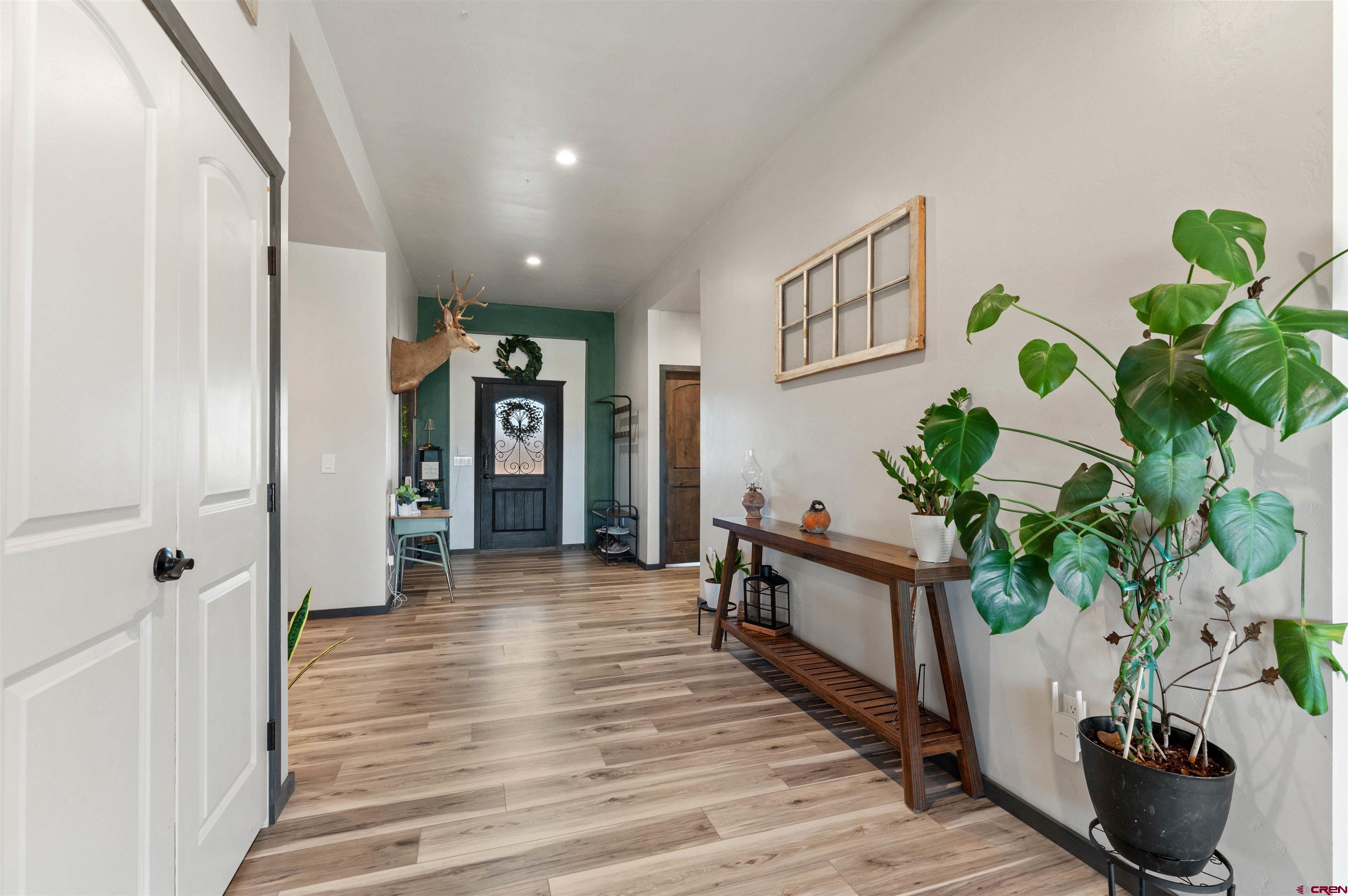 55347 Begonia Road Delta, CO 81416 - Photo 20 of 44 a living room with furniture and a potted plant