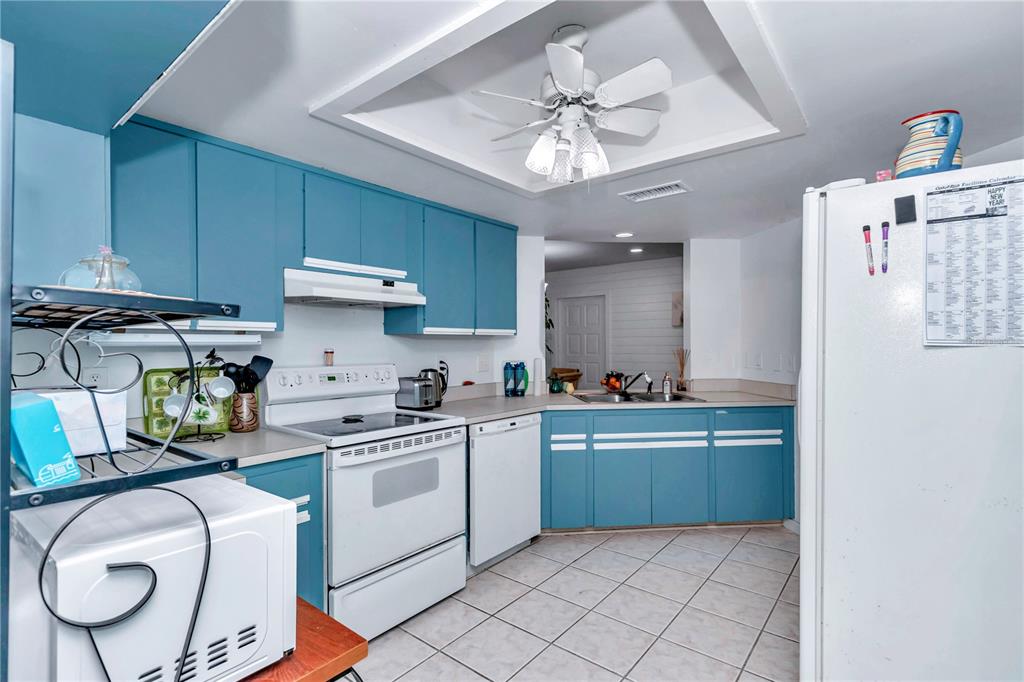 10901 Southwest 80th Court Ocala, FL 34481 - Photo 12 of 46 a kitchen with cabinets and chairs