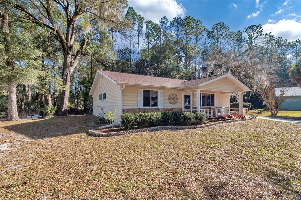 10901 Southwest 80th Court Ocala, FL 34481 - Photo 31 of 46 a view of a house with a yard
