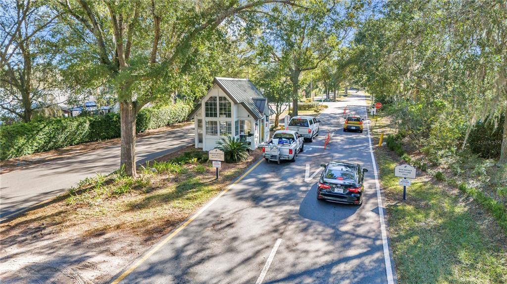 10901 Southwest 80th Court Ocala, FL 34481 - Photo 34 of 46 a view of a house with cars parked on the road