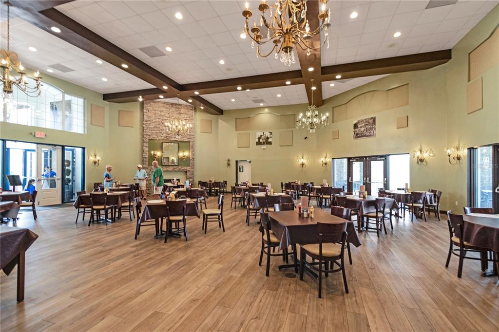 10901 Southwest 80th Court Ocala, FL 34481 - Photo 39 of 46 a view of a dining room with furniture and wooden floor