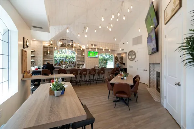 a view of a dining room with furniture and a fireplace