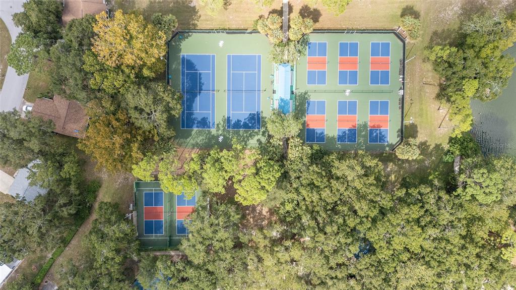 10901 Southwest 80th Court Ocala, FL 34481 - Photo 44 of 46 a building view with swimming pool and red brick