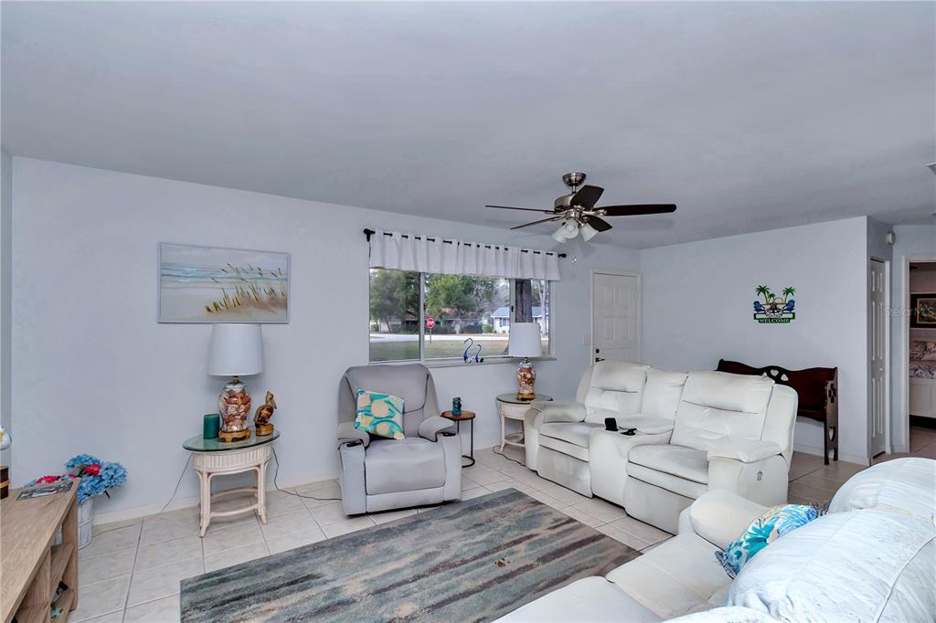10901 Southwest 80th Court Ocala, FL 34481 - Photo 5 of 46 a living room with furniture and a window