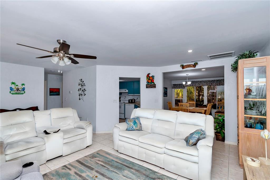 10901 Southwest 80th Court Ocala, FL 34481 - Photo 6 of 46 a living room with furniture and a ceiling fan