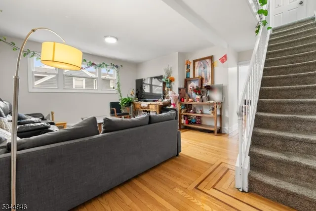 a bedroom with a bed dresser and a window
