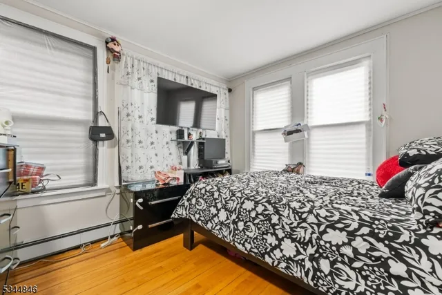 a bedroom with a bed and cabinets