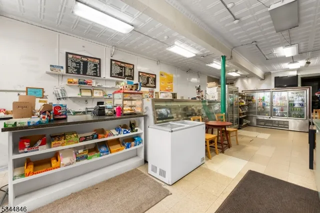 a kitchen with stainless steel appliances granite countertop a lot of counter space and cabinets