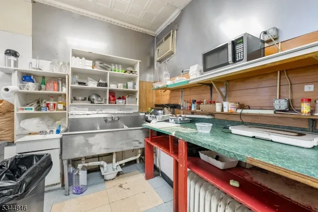 a kitchen with stainless steel appliances granite countertop a sink and cabinets