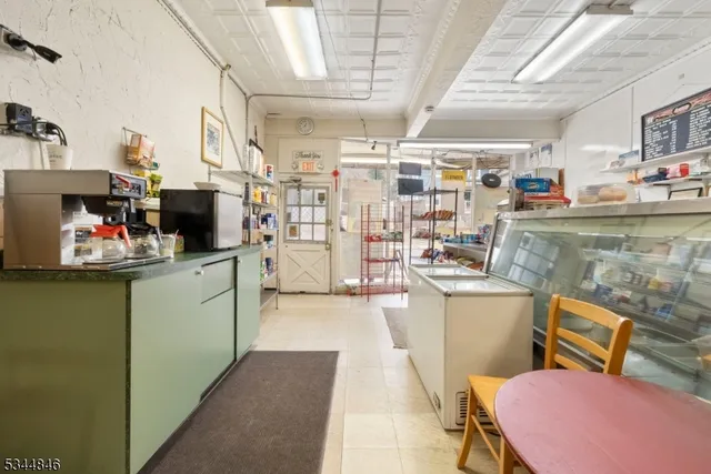 a bathroom with a sink toilet and a mirror
