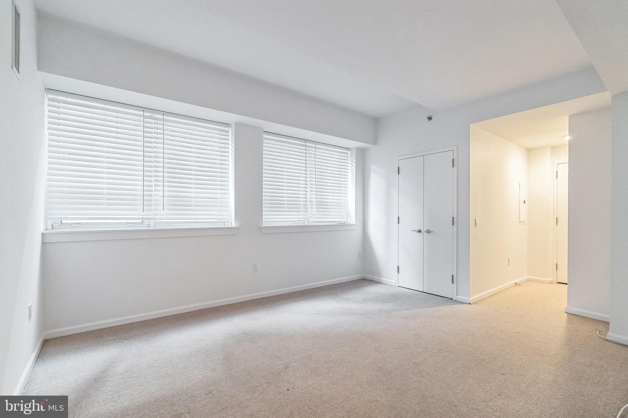 1425 Locust Street, Unit 3B Philadelphia, PA 19102 - Photo 6 of 13 a view of an empty room with a window