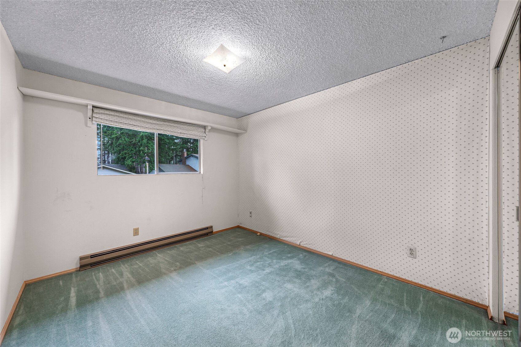 1834 Northeast Sumner Drive Oak Harbor, WA 98277 - Photo 13 of 37 an empty room with a window