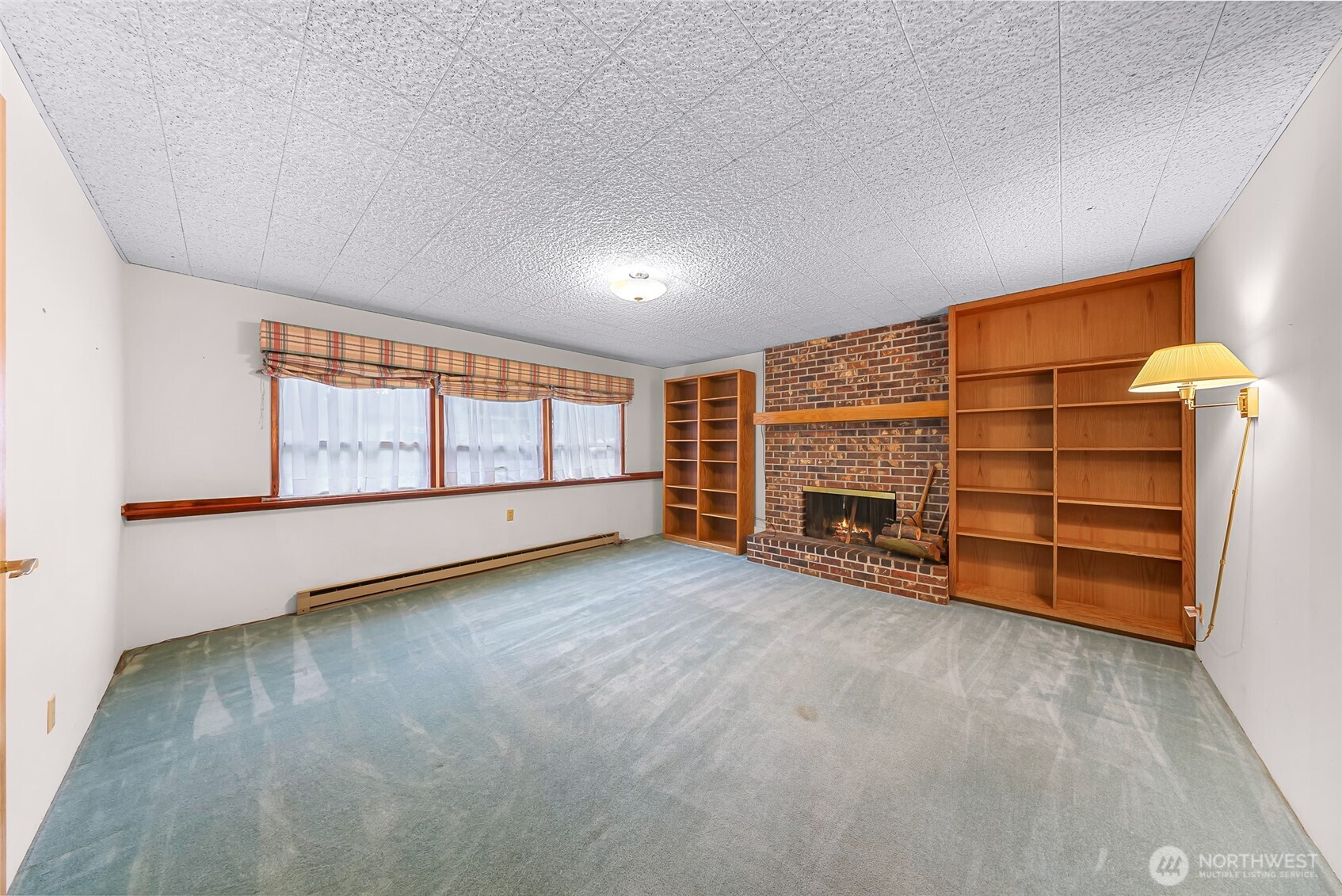 1834 Northeast Sumner Drive Oak Harbor, WA 98277 - Photo 24 of 37 a view of an empty room with a fireplace and window
