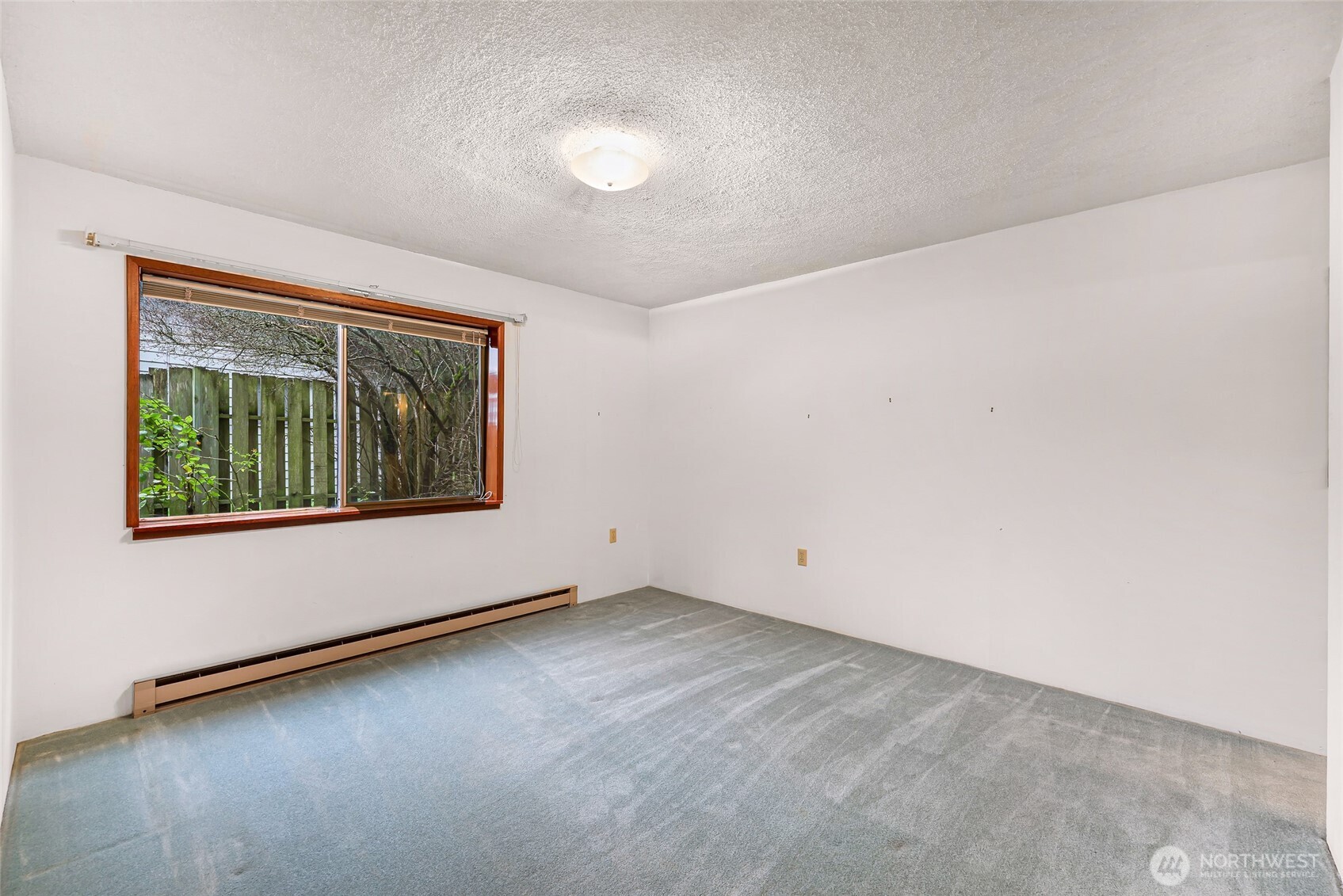 1834 Northeast Sumner Drive Oak Harbor, WA 98277 - Photo 27 of 37 an empty room with windows