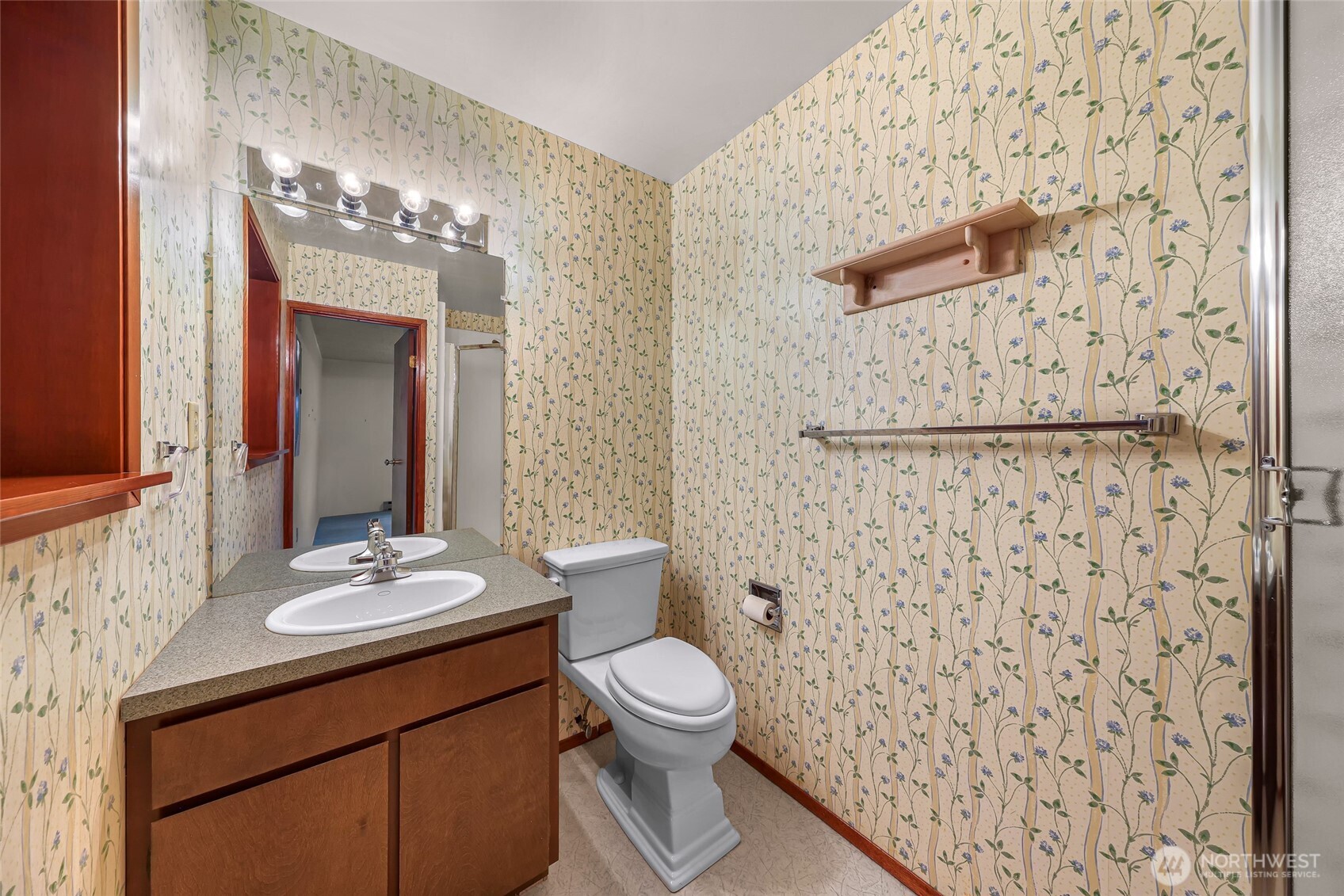 1834 Northeast Sumner Drive Oak Harbor, WA 98277 - Photo 29 of 37 a bathroom with a sink a toilet and shower curtain