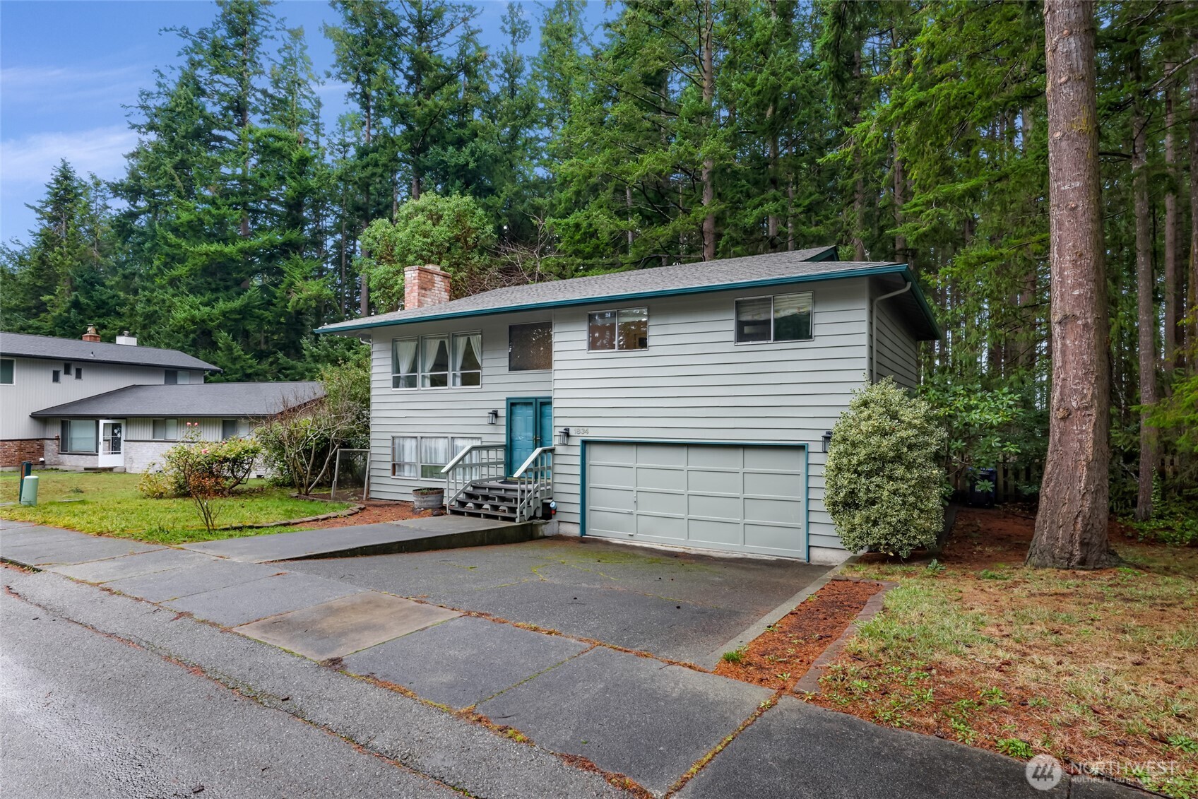 1834 Northeast Sumner Drive Oak Harbor, WA 98277 - Photo 36 of 37 front view of a house with a yard