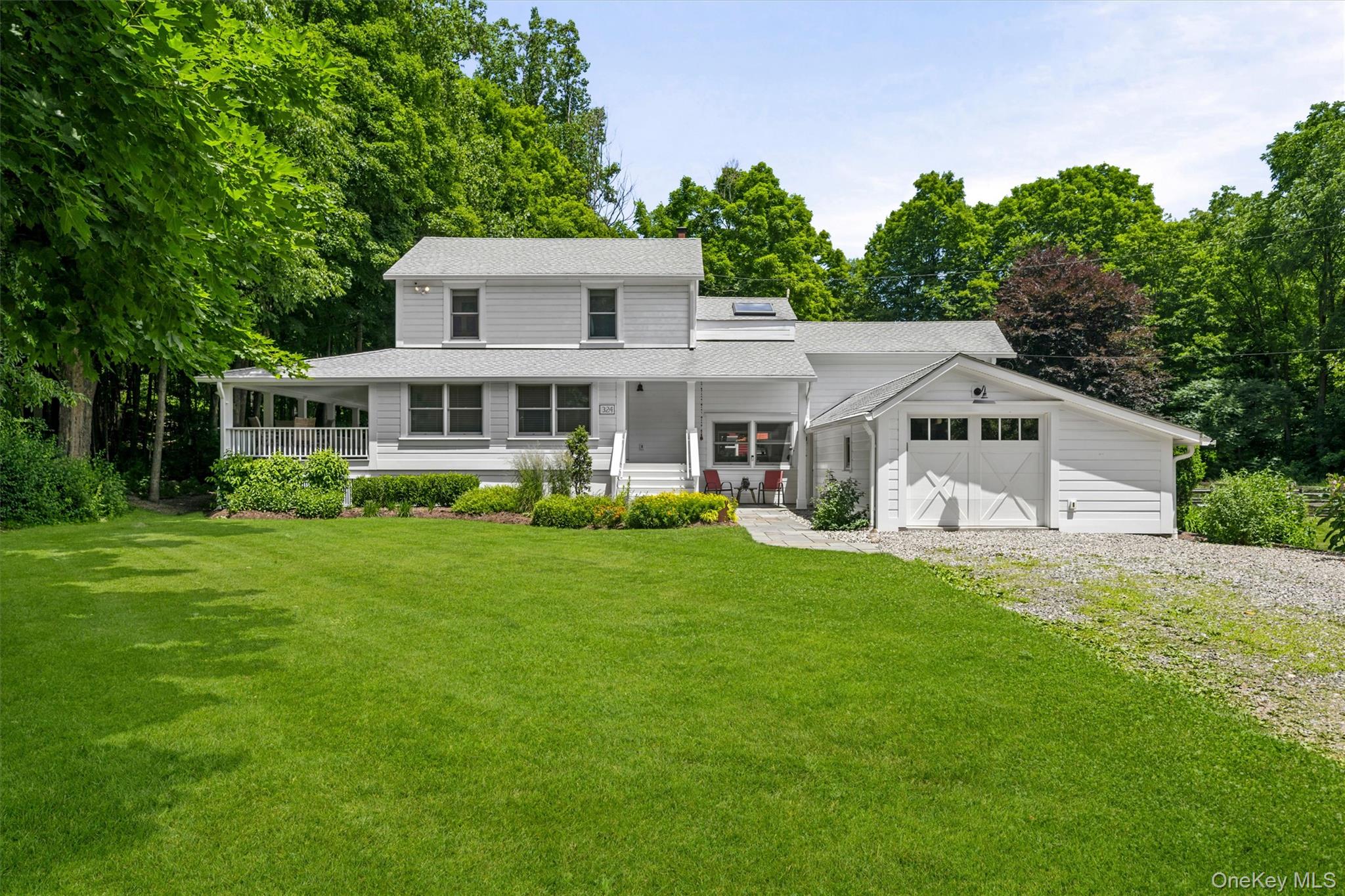 324 Haverstraw Road Suffern, NY 10901 - Photo 2 of 50 a aerial view of a house with a yard table and chairs
