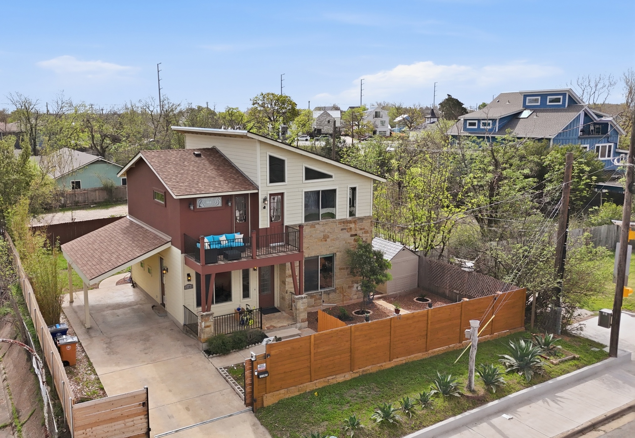 a view of a house with a chairs in a patio