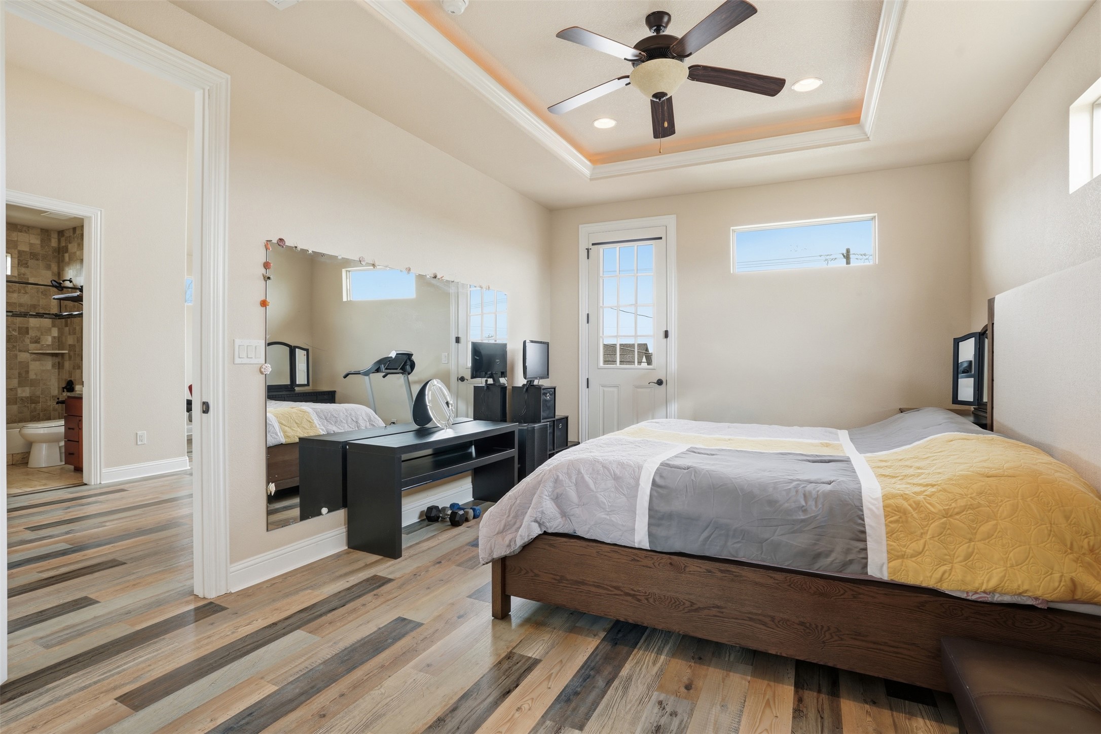 1185 Springdale Road Austin, TX 78721 - Photo 13 of 32 a bedroom with a bed and a chandelier