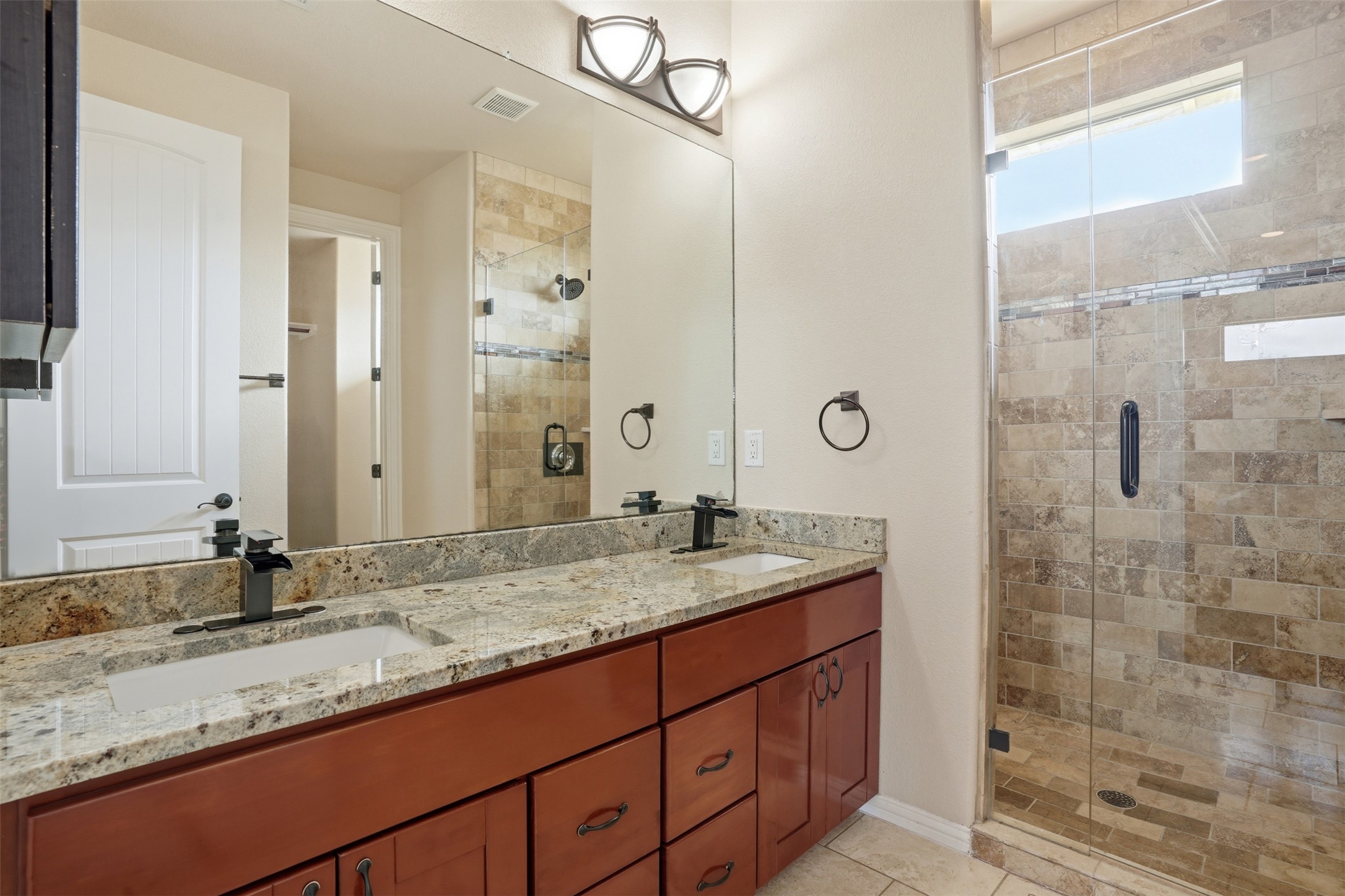 1185 Springdale Road Austin, TX 78721 - Photo 14 of 32 a bathroom with a granite countertop sink mirror and double