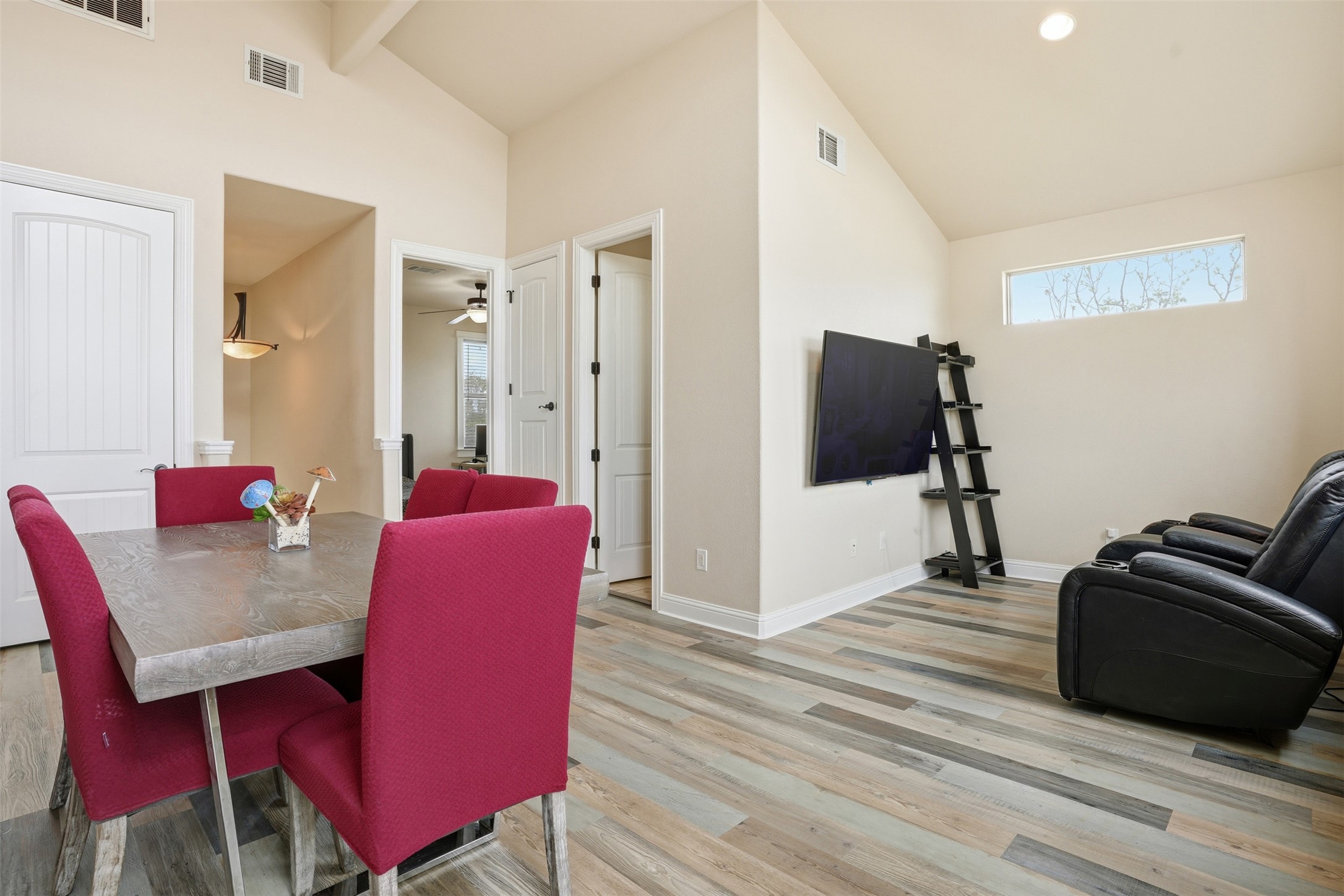 1185 Springdale Road Austin, TX 78721 - Photo 17 of 32 a living room with furniture and a wooden floor