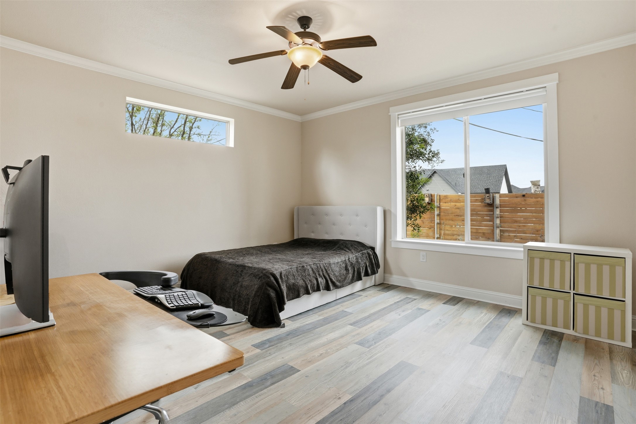 1185 Springdale Road Austin, TX 78721 - Photo 19 of 32 a bedroom with a bed and a window