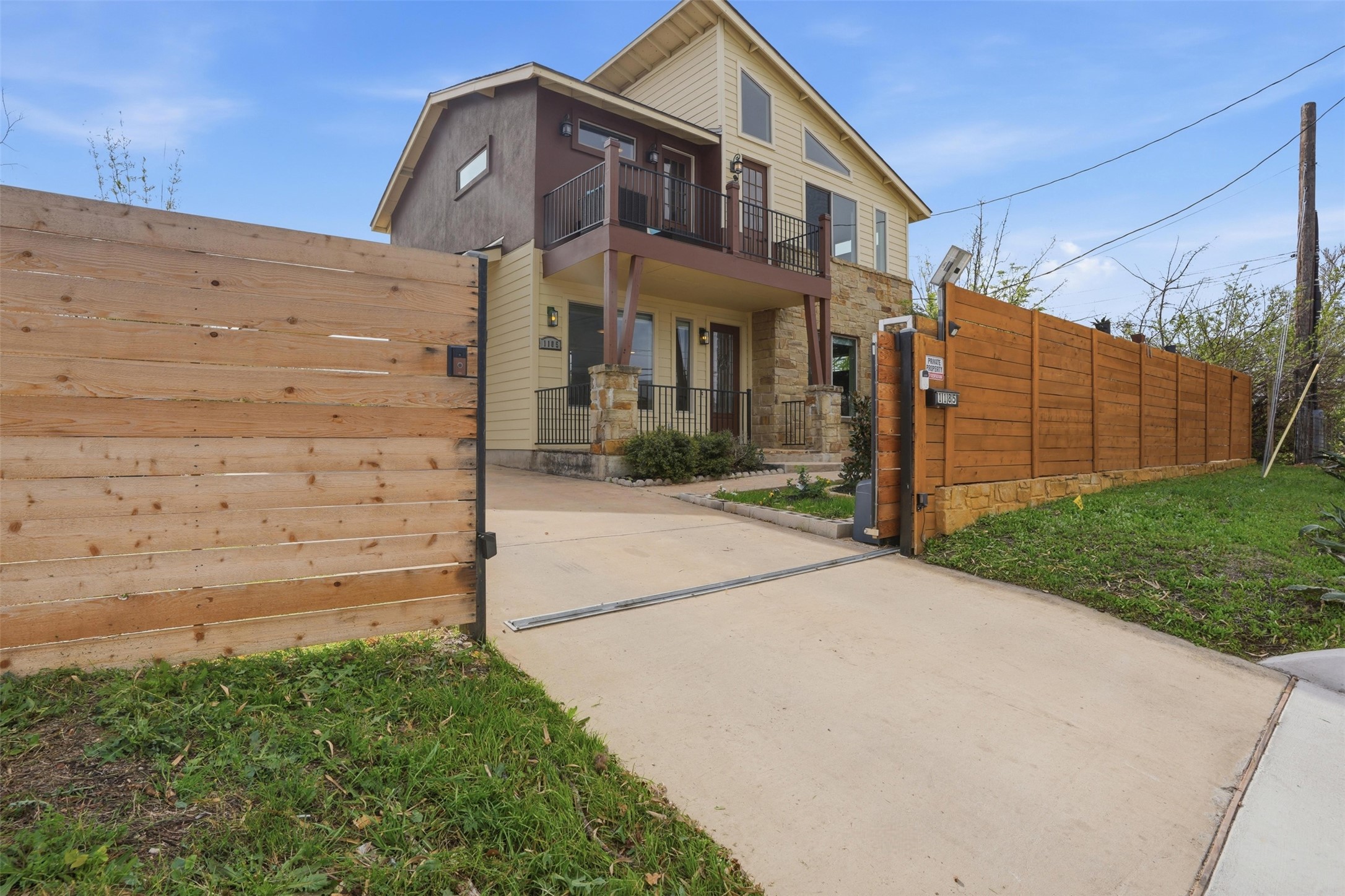 1185 Springdale Road Austin, TX 78721 - Photo 2 of 32 a view of a house with a small yard and potted plants