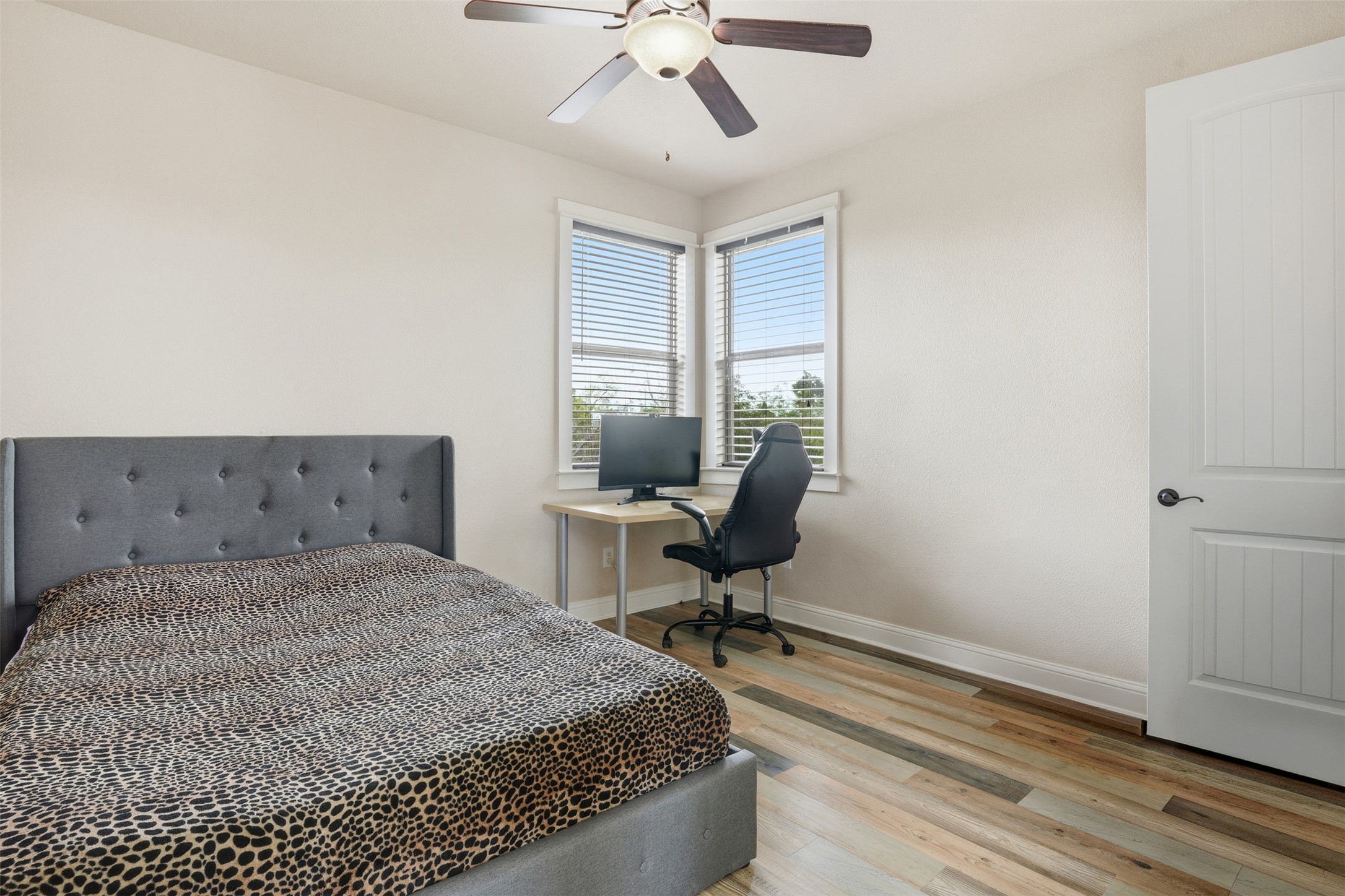 1185 Springdale Road Austin, TX 78721 - Photo 23 of 32 a bedroom with a bed and a window