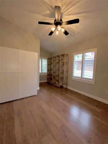 a bathroom with a double vanity sink a toilet and a mirror