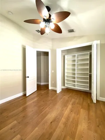 a view of a hallway with a chandelier