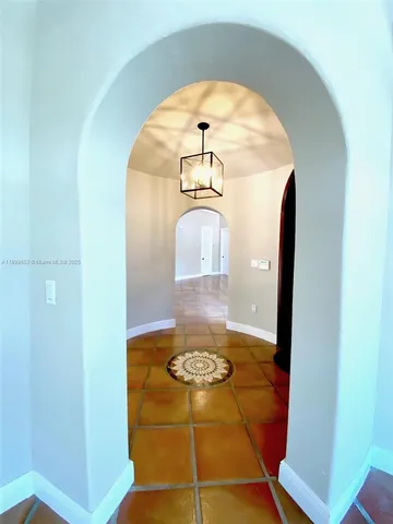 a view of a hallway view with staircase