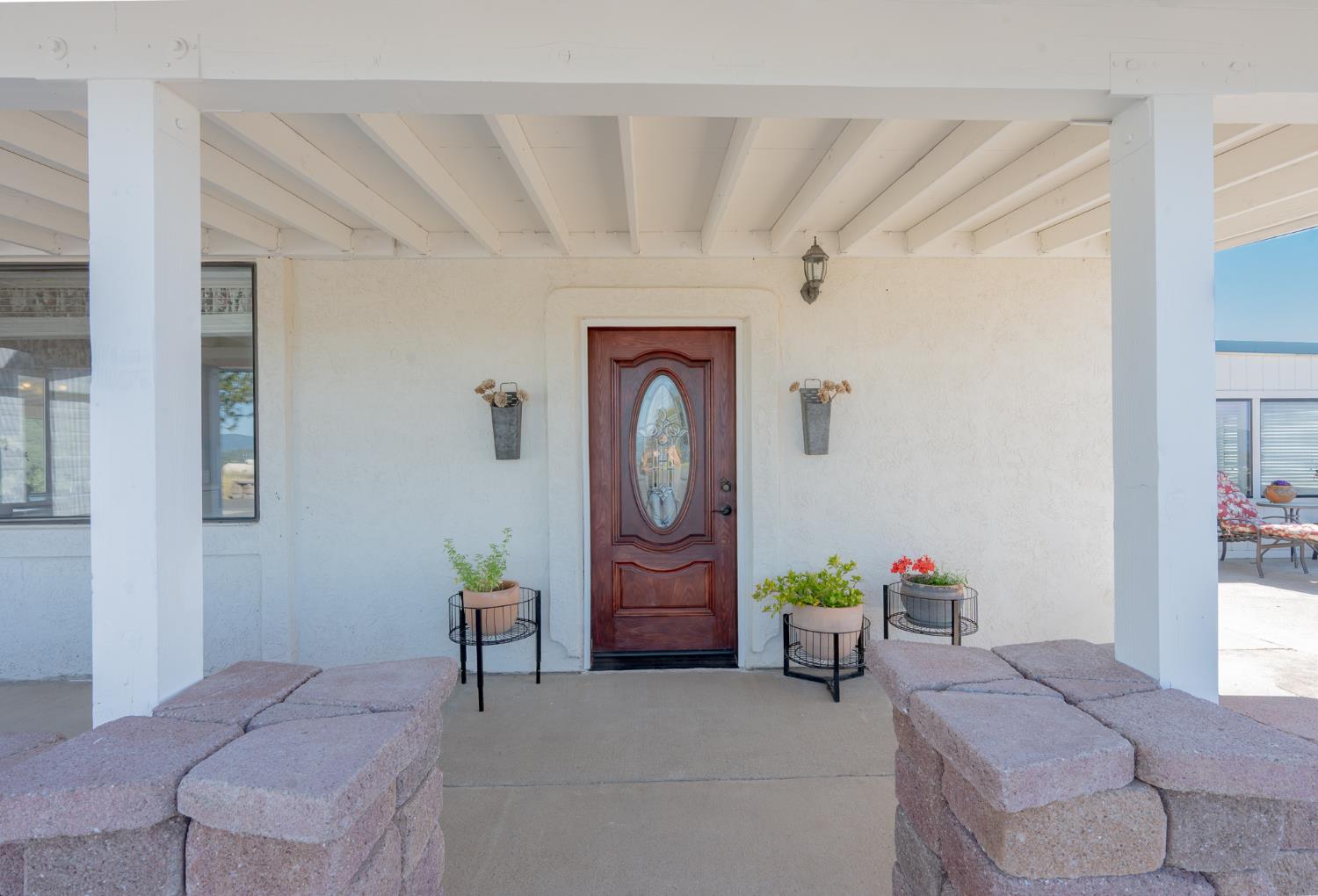 5912 Old Gulch Road San Andreas, CA 95249 - Photo 23 of 71 a bedroom with a bed and a chandelier