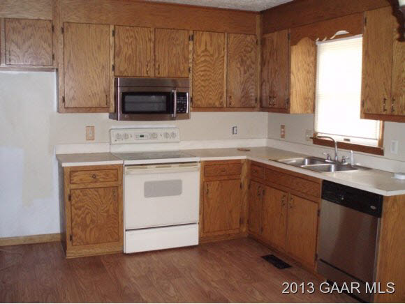 117 Ox Road Waynesboro, VA 22980 - Photo 4 of 10 a kitchen with a sink stove and microwave