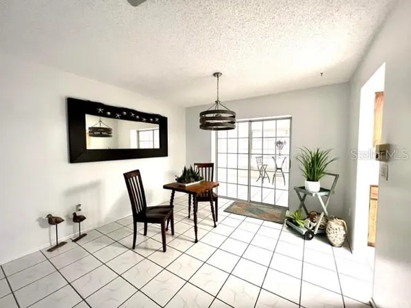 a view of a livingroom with furniture and a potted plant