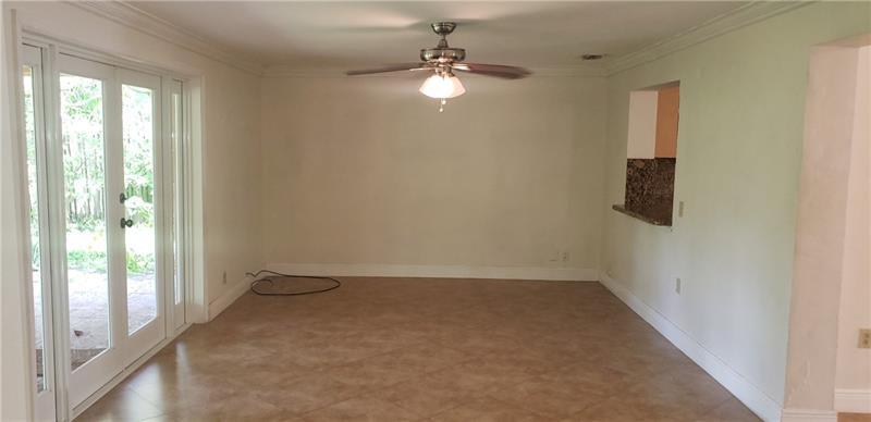 98 Seminole Lane Boca Raton, FL 33487 - Photo 19 of 42 a view of a room with a windows and ceiling fan