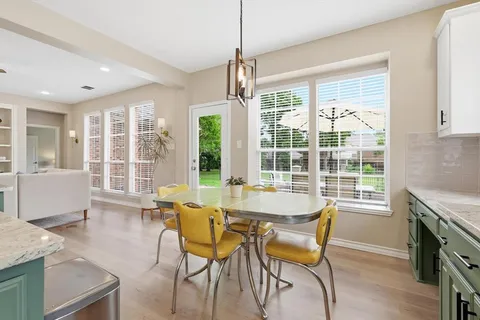 a dining room with furniture window wooden floor