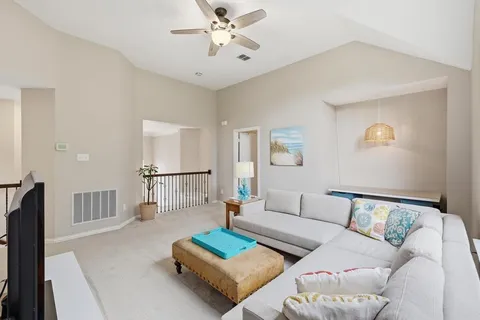 a living room with furniture and a couch