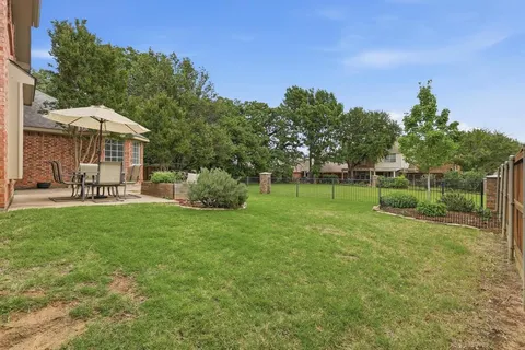 a view of a park with large trees