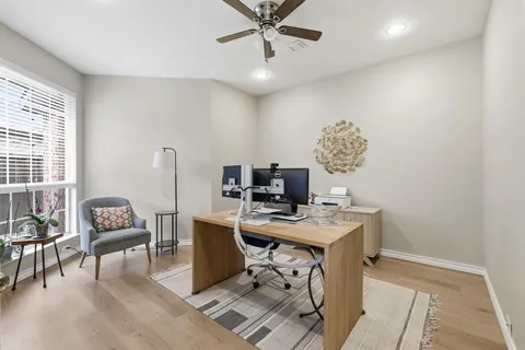 a view of a workspace with furniture and a livingroom