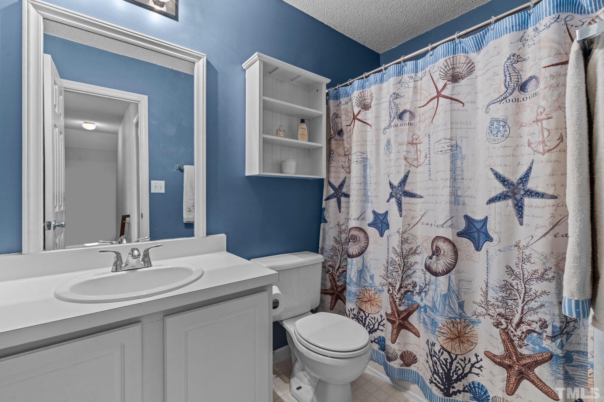 506 Ashford Lane Durham, NC 27713 - Photo 14 of 27 a bathroom with a sink and toilet