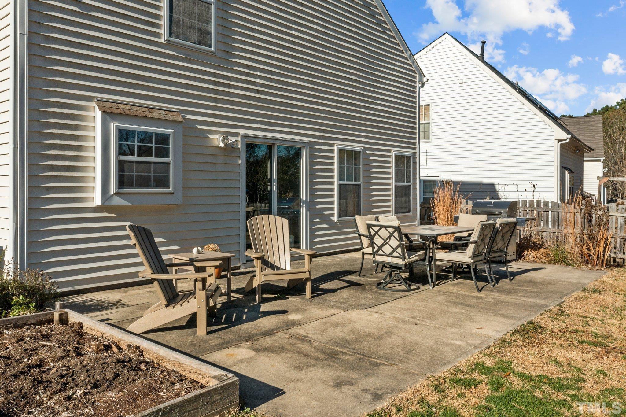 506 Ashford Lane Durham, NC 27713 - Photo 21 of 27 a view of a dinning table and chairs in the patio