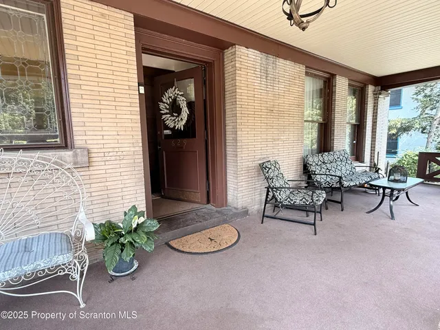 a view of lobby with furniture and potted plant