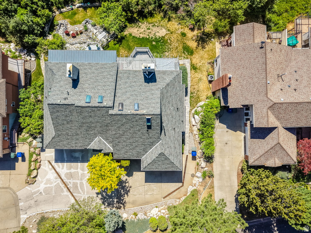5057 South Ridgedale Drive Ogden, UT 84403 - Photo 65 of 69 Aerial view of a sprawling residential property featuring a multi-level roofline with skylights and multiple chimneys