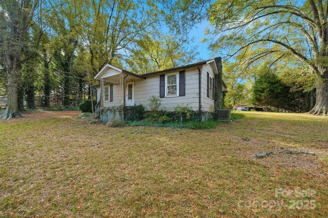 an aerial view of houses with yard