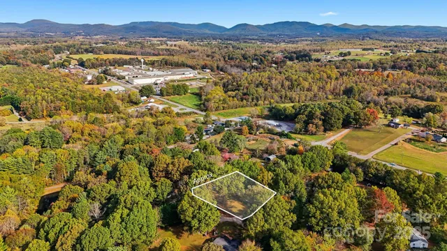a swimming pool with some trees in the background