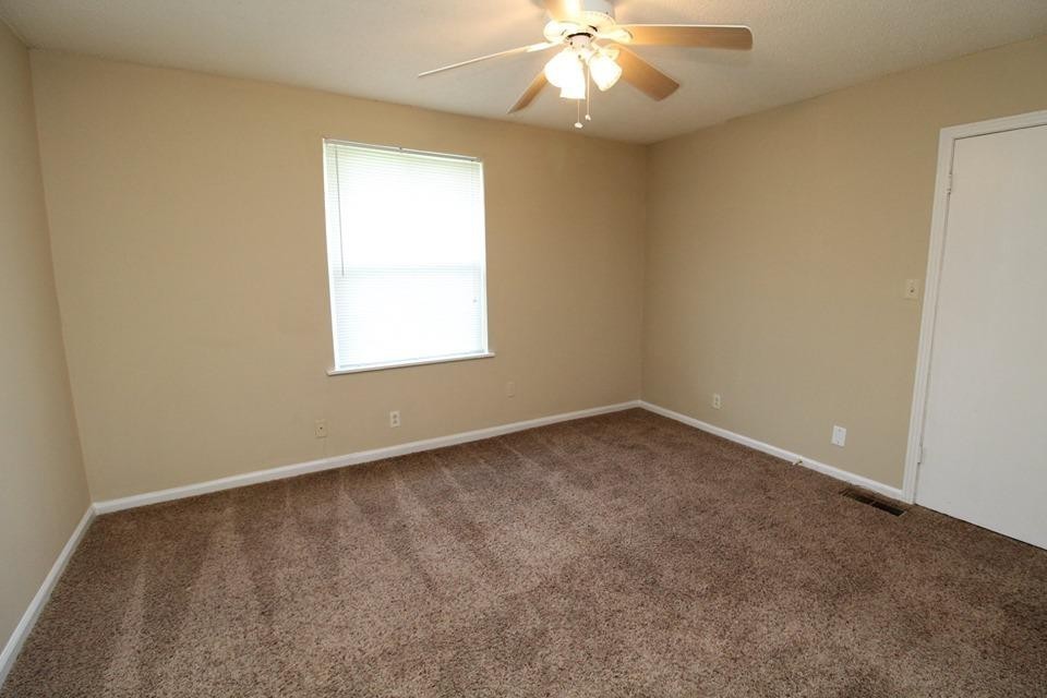 1088 Pembroke Oak Grove Road, Unit 21 Oak Grove, KY 42262 - Photo 4 of 6 an empty room with a window