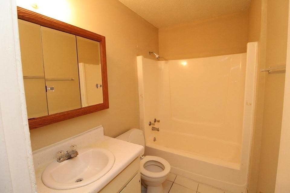 1088 Pembroke Oak Grove Road, Unit 21 Oak Grove, KY 42262 - Photo 6 of 6 a bathroom with a sink a toilet and shower